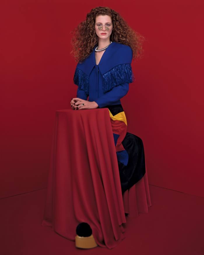 Loewe wool and silk jacket, £2,100, and viscose skirt, £1,300. Undercover leather and PVC shoes, £750. Metal and cardboard glasses, loaned from La Compagnie du Costume. Sportmax metal Felix necklace, £210. Ilaria Icardi gold and bloodstone ring, £2,400