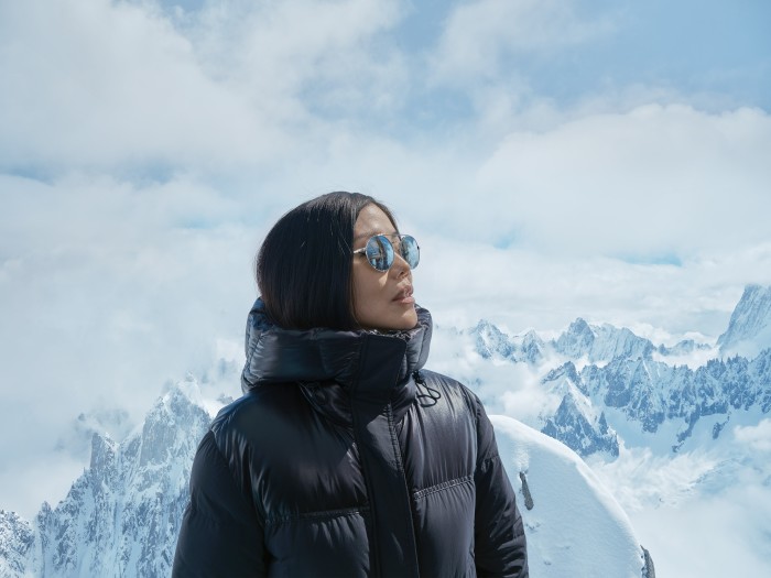 Ikuzawa wears Moncler jacket and Persol sunglasses in the Alps