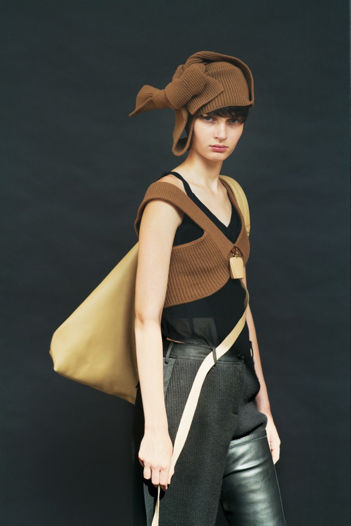 Knitwear knows no bounds. Eléonore wears Burberry wool top with leather bell pendant, cashmere shorts, cashmere corset, wool trapper hat, all POA, leather Astra bag, £2,850, and black faux-leather boots, £1,790