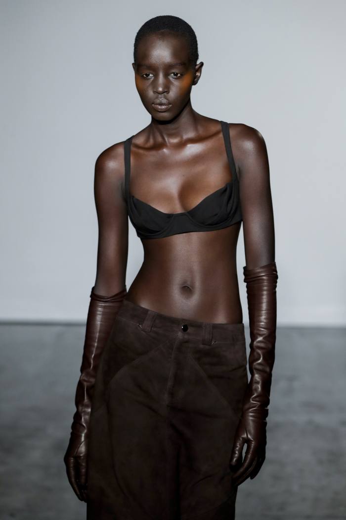 A model wearing long leather gloves on the runway at Maximilian Davis’s show at London Fashion Week in February