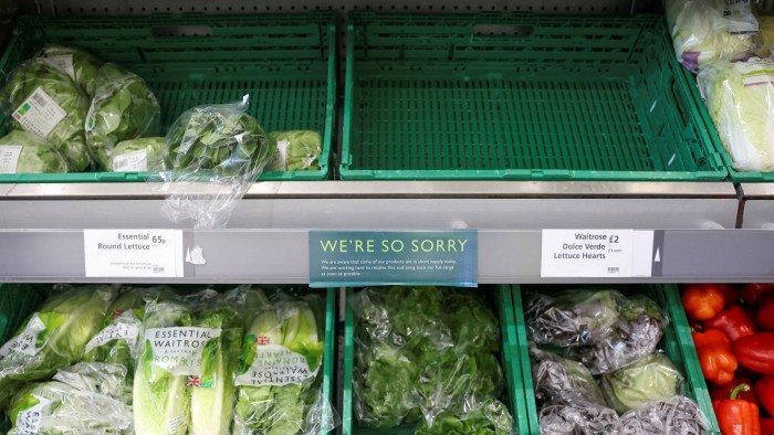 An empty vegetable crate in a Waitrose shop in London