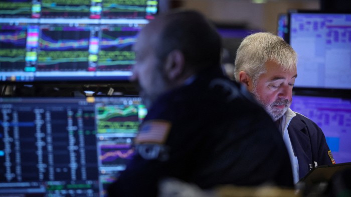 Traders on floor of New York Stock Exchange