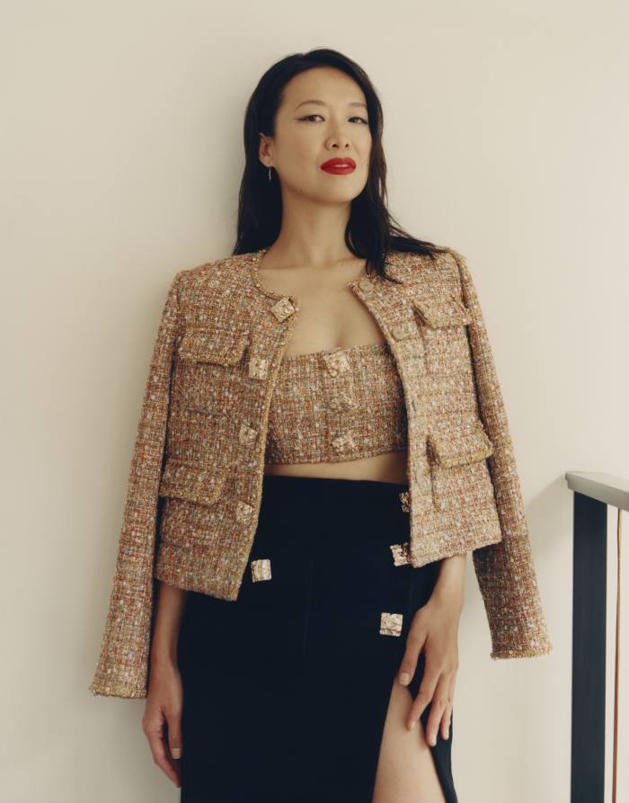 Rosey Chan wears Self-Portrait tinsel jacket, £450, matching crop top, £150, and wool skirt, £260