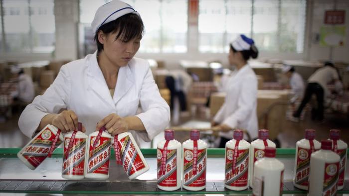 Factory workers at the liquor maker Kweichow Moutai 