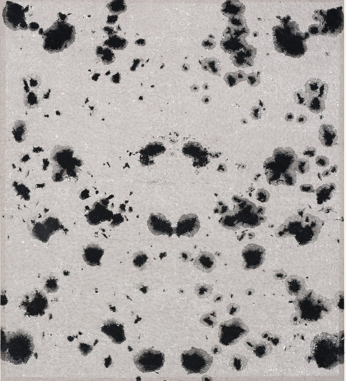 In an abstract painting, dark dots of paint form a butterfly-like shape against a grey background.