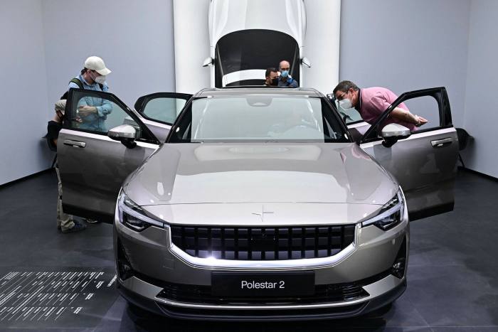 Visitors check out a Polestar 2 car at the International Motor Show in Munich, southern Germany, this month 