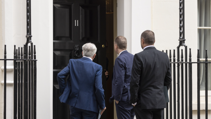 Members of the UK’s Office for Budget Responsibility outside Number 11 Downing Street