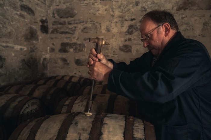 Jamieson uses a bung extractor to remove a bung from an Ardross cask