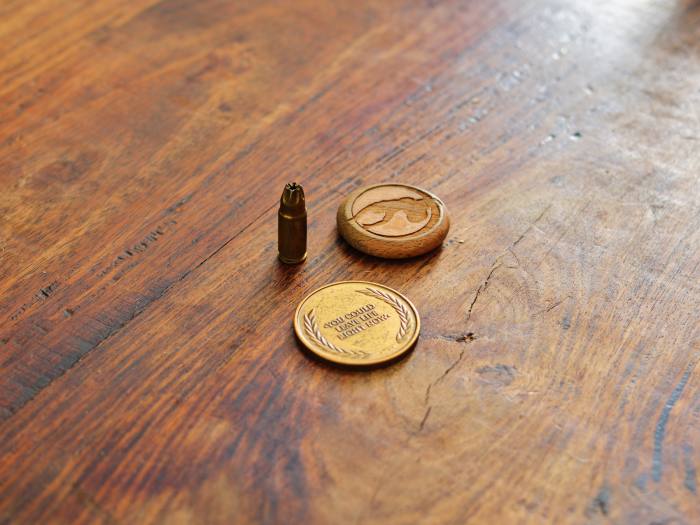 Foucan’s Bond bullet and reminder coins