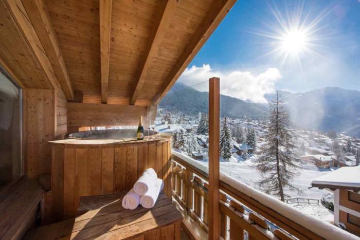 A hot tub on the balcony at No. 14 Verbier, with views of the Grand and Petit Combin