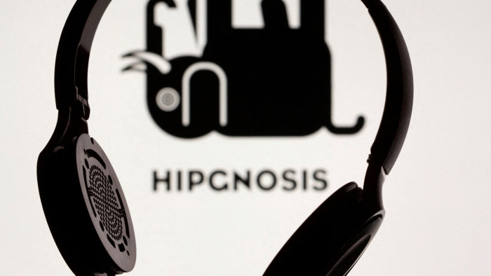 An illustration with a pair of headphones in front of a Hipgnosis logo