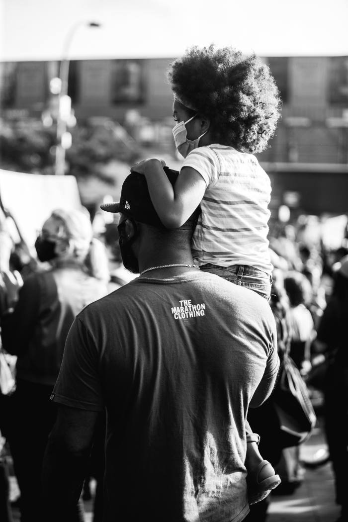 Brooklyn, May 30. A father and his daughter attend a protest at the Barclays Center