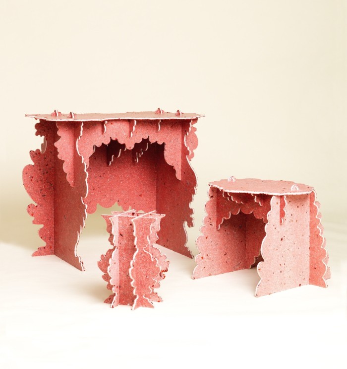 A stool, table and mantepliece made from pinkish card