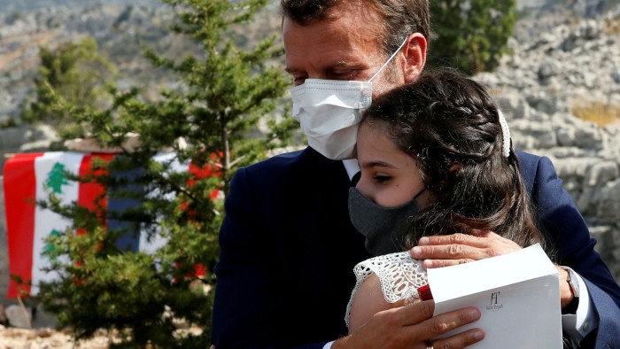 Emmanuel Macron hugs a victim of the Beirut port explosion. He told the country's leaders: 'If your political class fails, then we will not come to Lebanon’s aid'