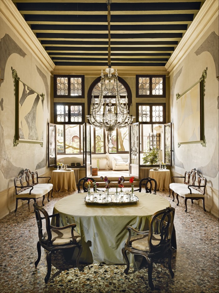 The dining room in Palazzo Alverà. The 19th-century frescoes are now hung with custom paintings by Sadaharu Horio