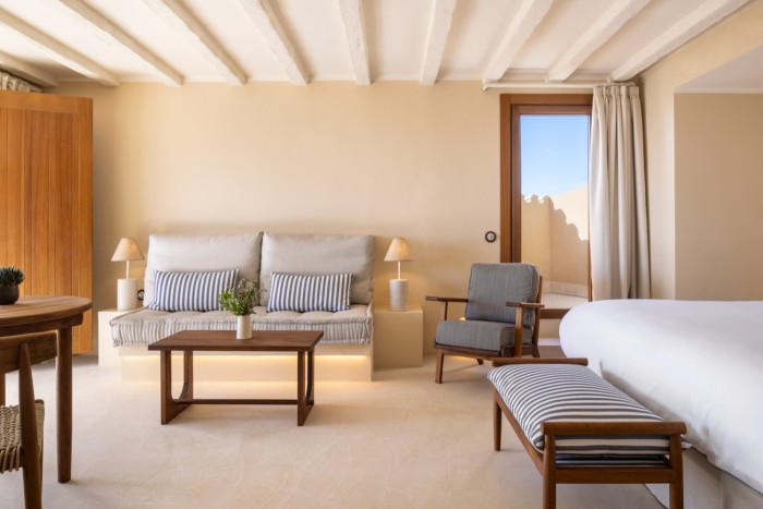The palette is white, sand and terracotta, with plenty of teak