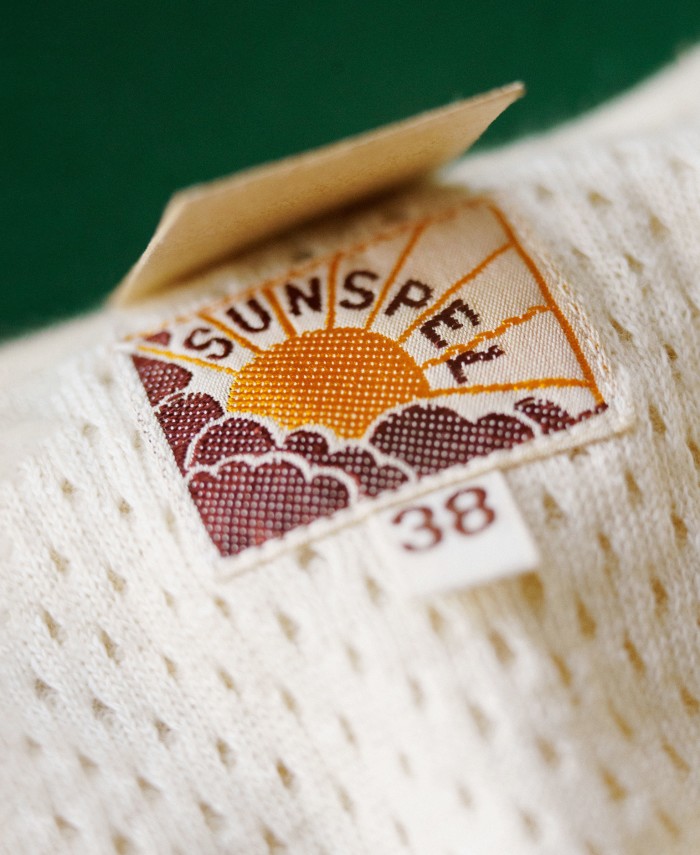 Sunspel’s 1950s logo of the sun breaking through the clouds