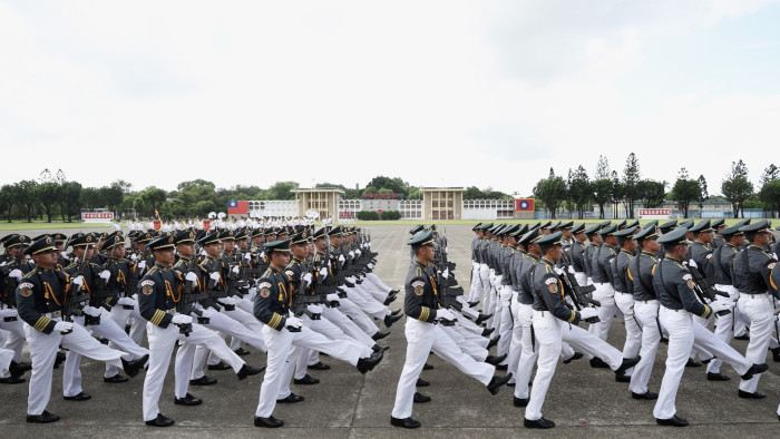 Taiwanese cadets march during the Republic of China Military Academy centennial celebrations in Kaohsiung, Taiwan on Saturday