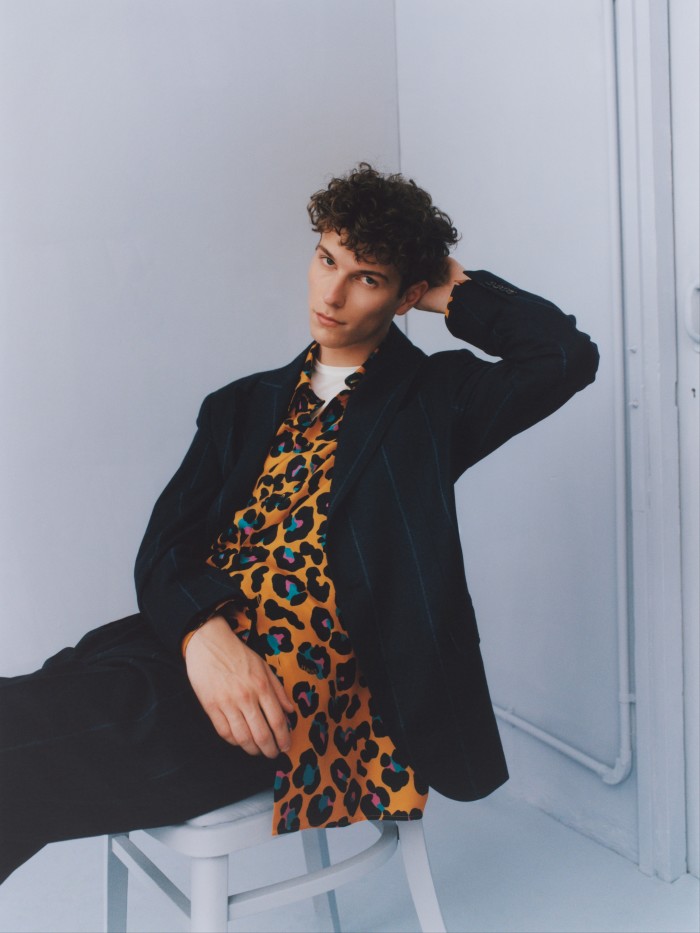 Brunello Cucinelli wool, silk and cashmere blazer, £6,445, and matching trousers, £2,300. Versace silk shirt, £975. Sunspel cotton T-shirt, £75