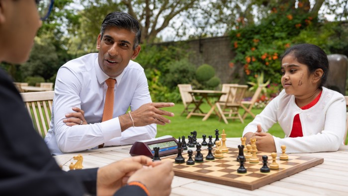 Prime Minister Rishi Sunak chats with young chess players in the garden of Downing Street 