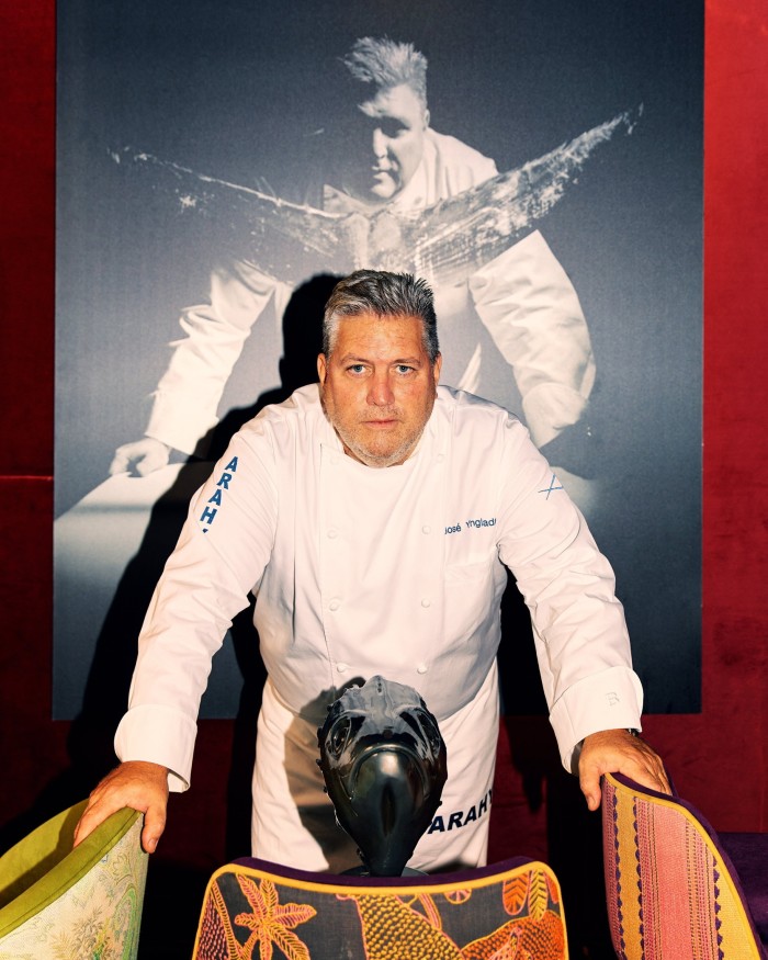 Arahy chef/patron José Raimundo Ynglada in front of a poster of himself