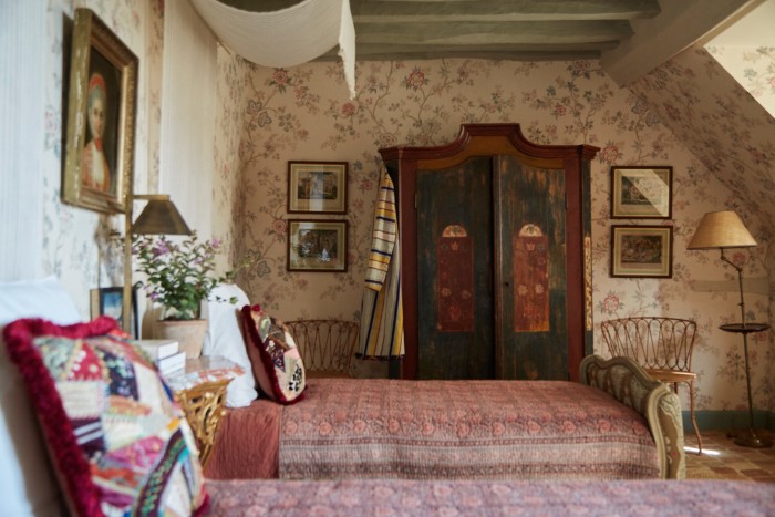 A guest bedroom at Peter Copping’s Normandy château, with La Carlière Colombier cushions, £1,125