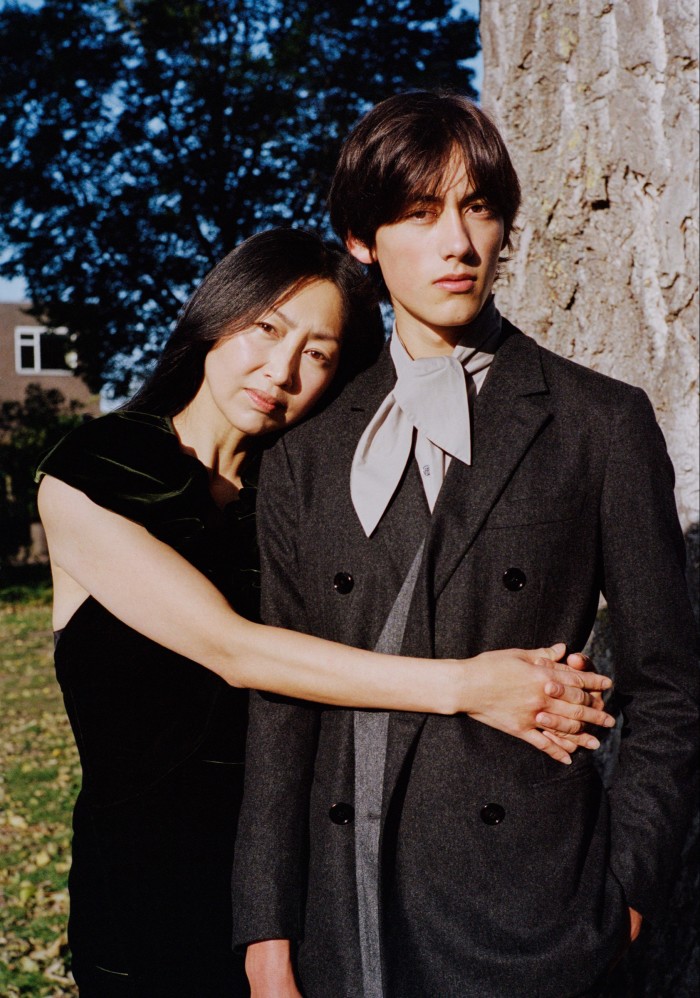 Chie Kanado-Jansen, left, runs a catering business, likes to read and loves to travel. Her son Naoki Jansen, right, is a high-school student. He studies philosophy and enjoys reading. Chie wears Ralph Lauren Collection velvet dress, £3,560. Naoki wears Hermès wool flannel suit, POA, and cotton poplin shirt, £490
