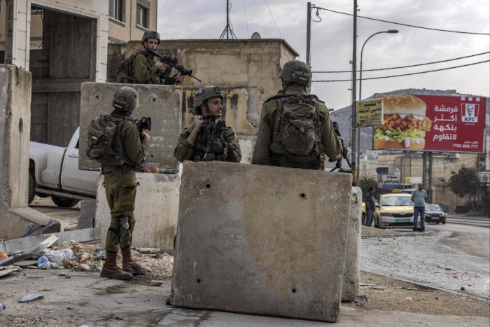 Israeli soldiers on duty in the Palestinian village of Huwara, south of Nablus