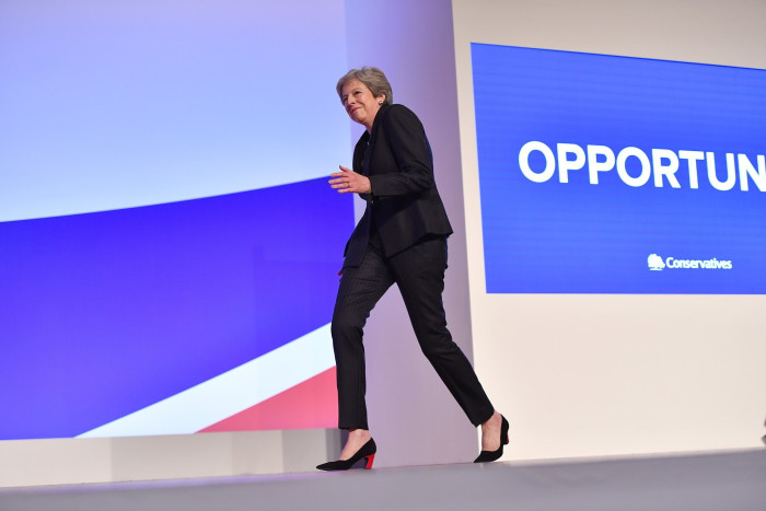 Theresa May dances on to the stage to deliver her Conservative party conference speech in 2018