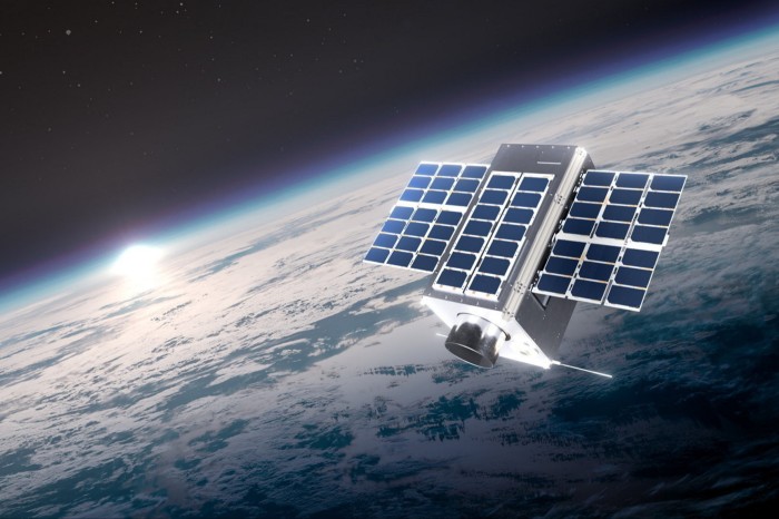 A man-made satellite floating in space, above the Earth’s atmosphere