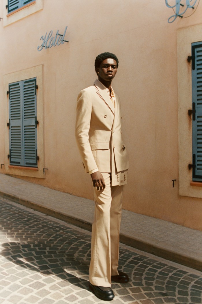 Dior cotton and silk voile jacket with removable front scarf, £3,400, and matching trousers, £1,150. Bally silk shirt, £900. Jacquemus leather Les Mocassins Bricciola loafers, £615. Versace golden-metal La Medusa earrings, POA