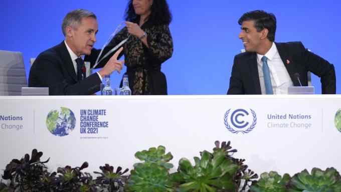 Chancellor Rishi Sunak and Mark Carney, attend a photocall with world finance ministers at COP26