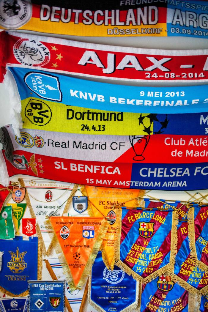 A collection of football scarves and match pennants