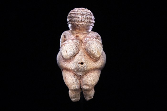 A figurine of a buxom woman