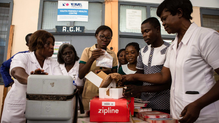 African nurses inspecting medical supplies sent by drone