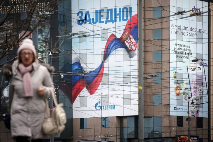 A billboard advertisement for Gazprom PJSC, featuring the Russian and Serbian national flags