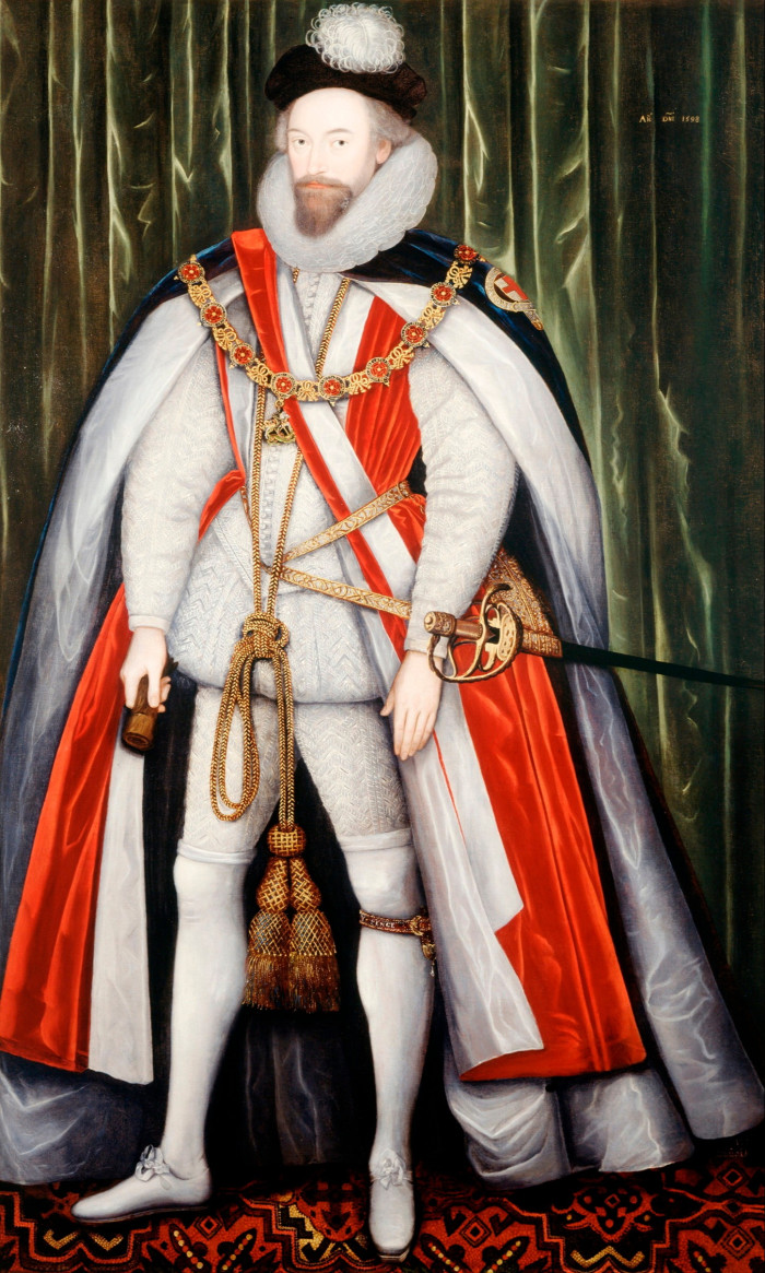 In a painting, a young man wearing an Elizabethan black, red, white and gold velvet cape, a grey doublet and a black and white headpiece stands proudly before a green curtain, staring in front of him.