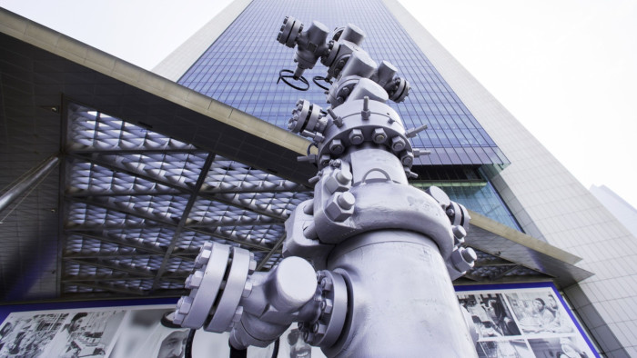 An oil pipeline control head sits on display outside the entrance to the Abu Dhabi National Oil Company (ADNOC) headquarters in Abu Dhabi