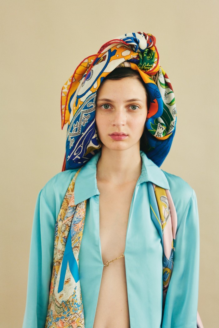 Eléonore wears Jacquemus viscose shirt, £370. Hermès silk Brides de Gala scarf (worn around head), £480, and silk twill Eleftheria scarf (around shoulders), £385. Models, Anna de Rijk, Laiza de Moura and Eléonore Ghiuritan at Viva London, and Madeleine Fischer at Women Paris. Casting, Leila Azizi at Suun Consultancy. Hair, Oummy Chan. Make-up, Gemma Smith-Edhouse at LGA Management. Photographer’s assistant, Léa Guintrand. Stylist’s assistants, Tine Kozjak and Ayako Hashimoto. Make-up assistant, Jay Kwan. Production, TheLink mgmt