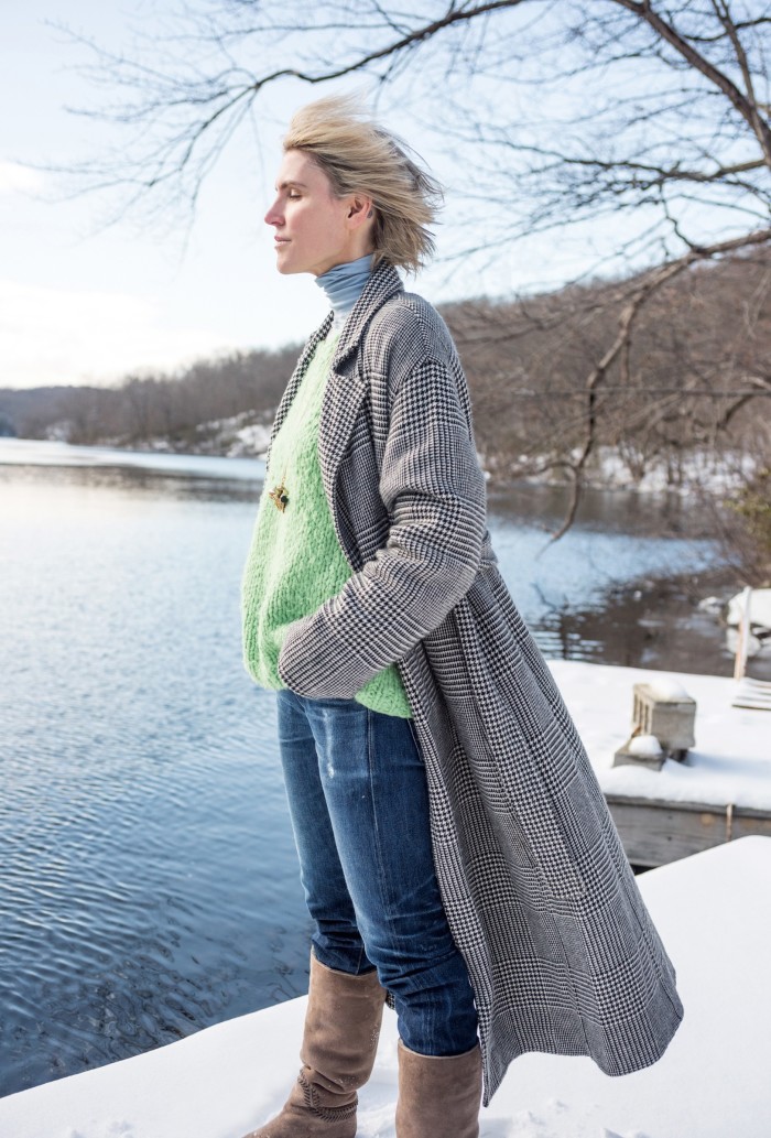 Gabriela Hearst next to the lake beside her upstate New York house, wearing her own label