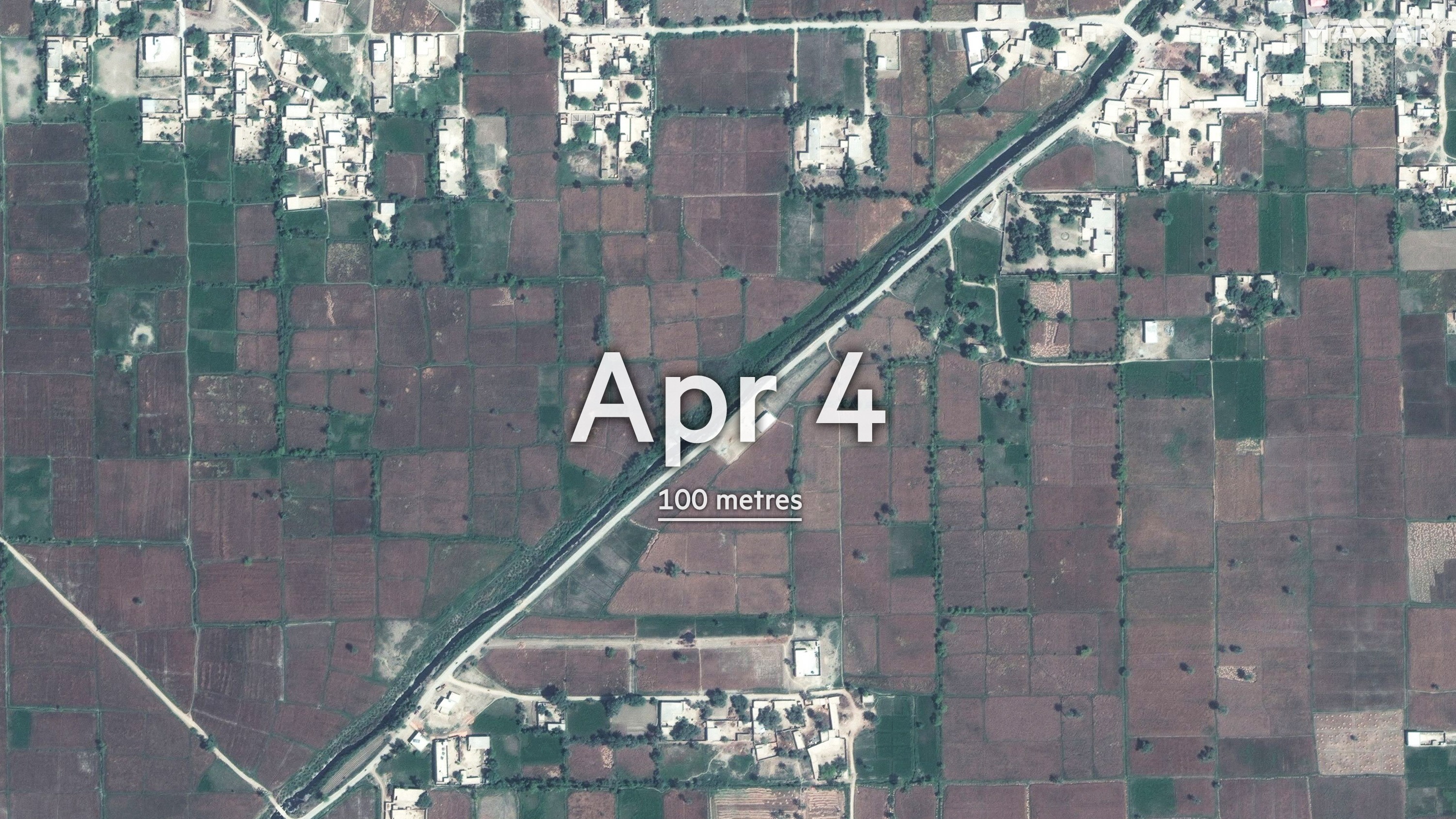 This satellite photo from Maxar shows area of farmland before floodwaters arrived in Gudpur, Punjab Province, Pakistan