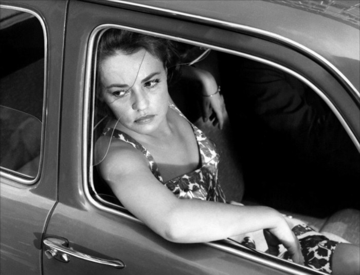 Jeanne Moreau sitting in the passenger seat of a car in Antonioni’s ‘La Notte’ 