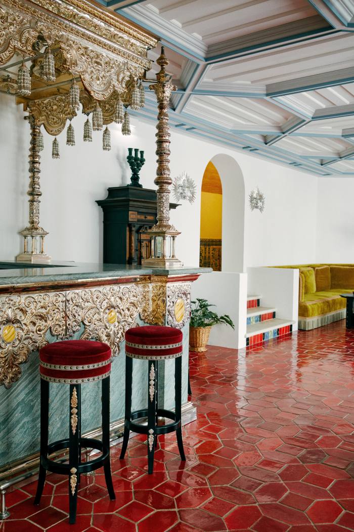 The hotel’s bar lounge. The bar itself is made of green-stone and hammered metal by traditional copperworkers in Seville