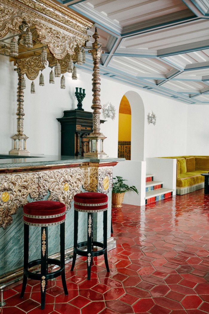 The hotel’s bar lounge. The bar itself is made of green-stone and hammered metal by traditional copperworkers in Seville