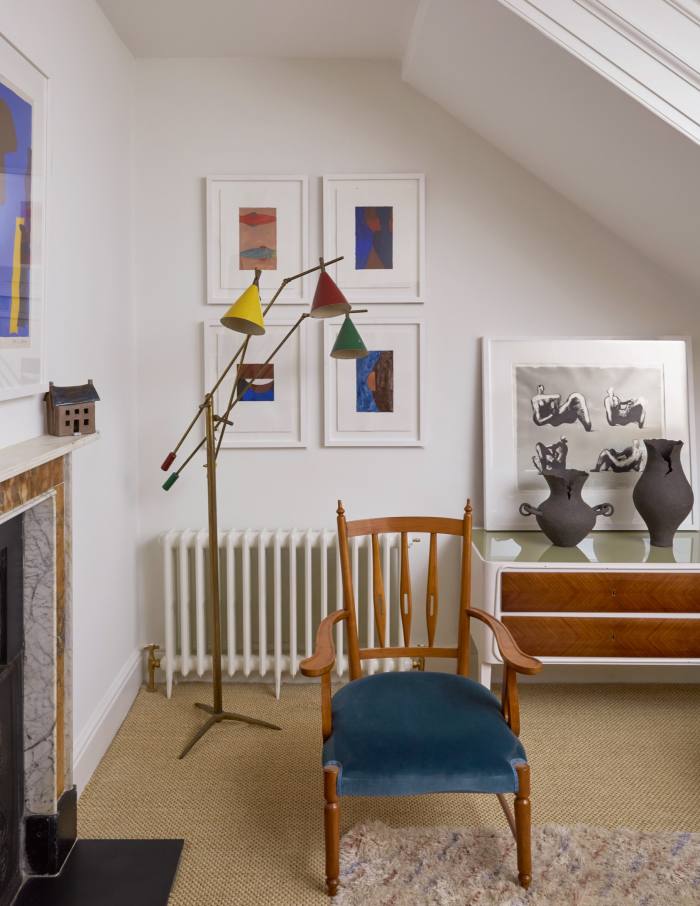A ’50s Italian armchair and Stillnovo floor lamp surrounded by artworks by Wayne Pate, Henry Moore and Patrick Heron