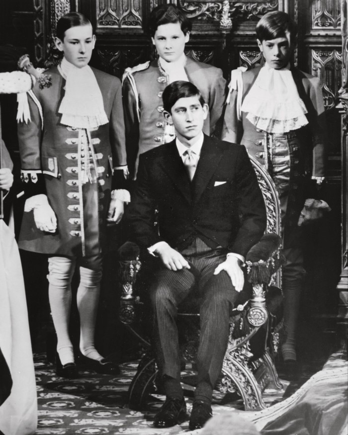 King Charles III with attendants including (back centre) Harry Fane in 1967