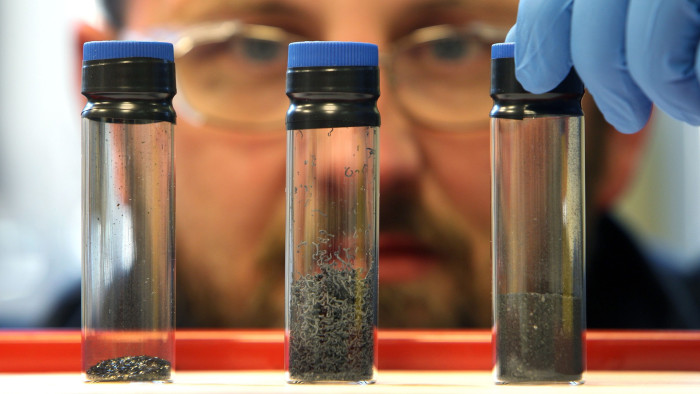 A researcher examines graphite samples 