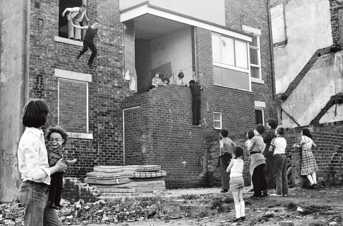 ‘Kids Jumping onto Mattresses’ from Youth Unemployment, 1981, by Tish Murtha