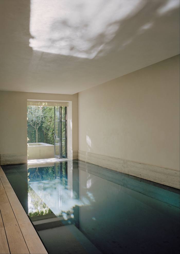 The basement pool continues the contemporary, light-filled aesthetic