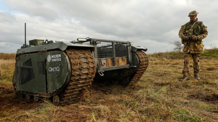 A British Army soldier, operates a THeMIS vehicle, developed by Milrem Robotics and QinetiQ Group 